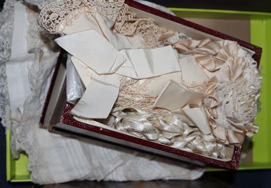 An ornate 19th century silk baby bonnet, six others, a white worked dress and a dolls dress and bib